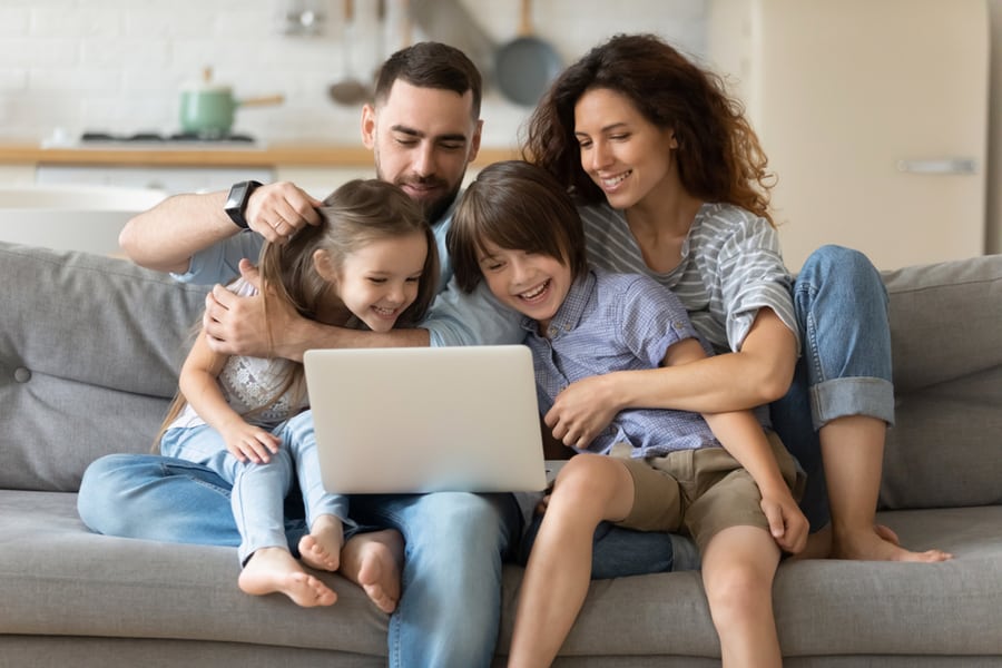 A Family Browsing Target Toy Catalog On The Website
