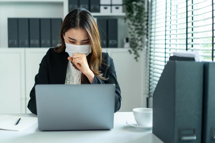 Asian Sick Businesswoman In Formal Wear Facemask And Work At Workplace