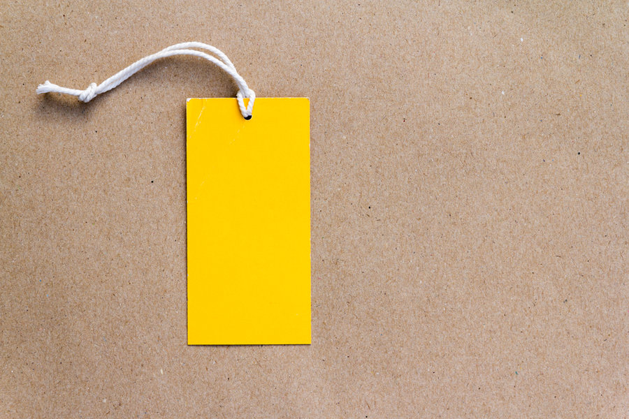 Emtry Yellow Price Tag On Brown Paper Background