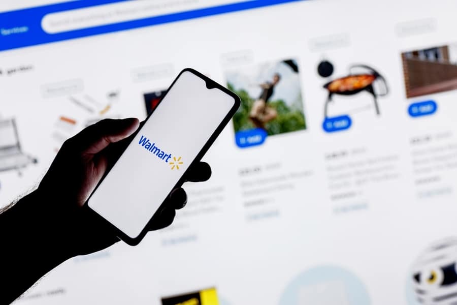 Man Accessing Walmart Through Website And App