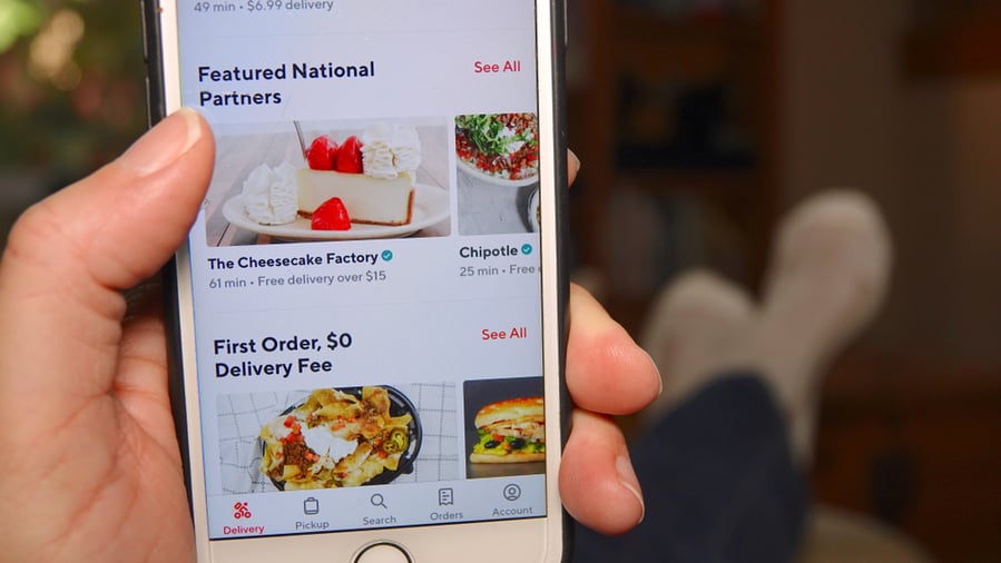 Person At Home, Using Doordash App To Order Food.