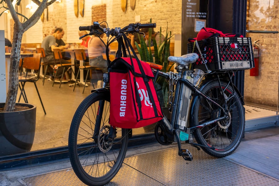 A Delivery Person's Bicycle Outside Of A Sweetgreen Restaurant With Grubhub