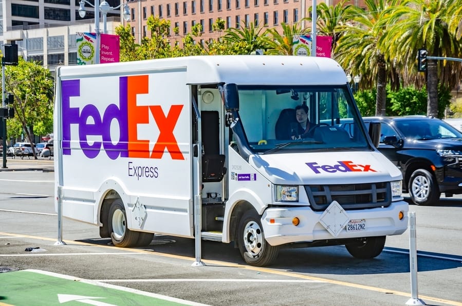 A White Fedex Courier Delivery Van