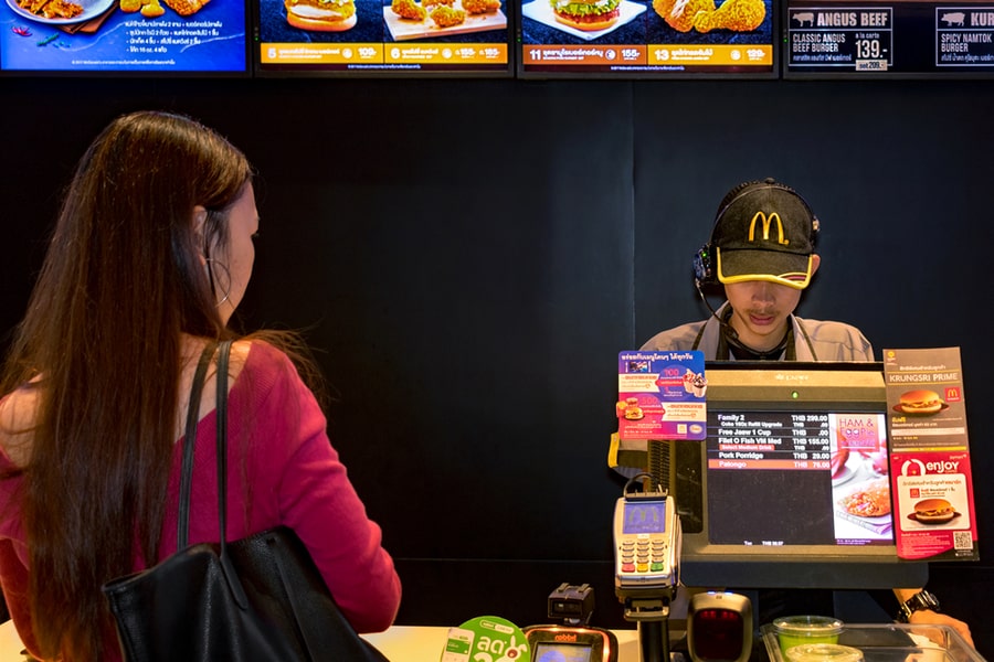 An Fast Food Employee Takes Orders From A Customer In Mcdonald's Counter In Bangkok, On November 05, 2017.