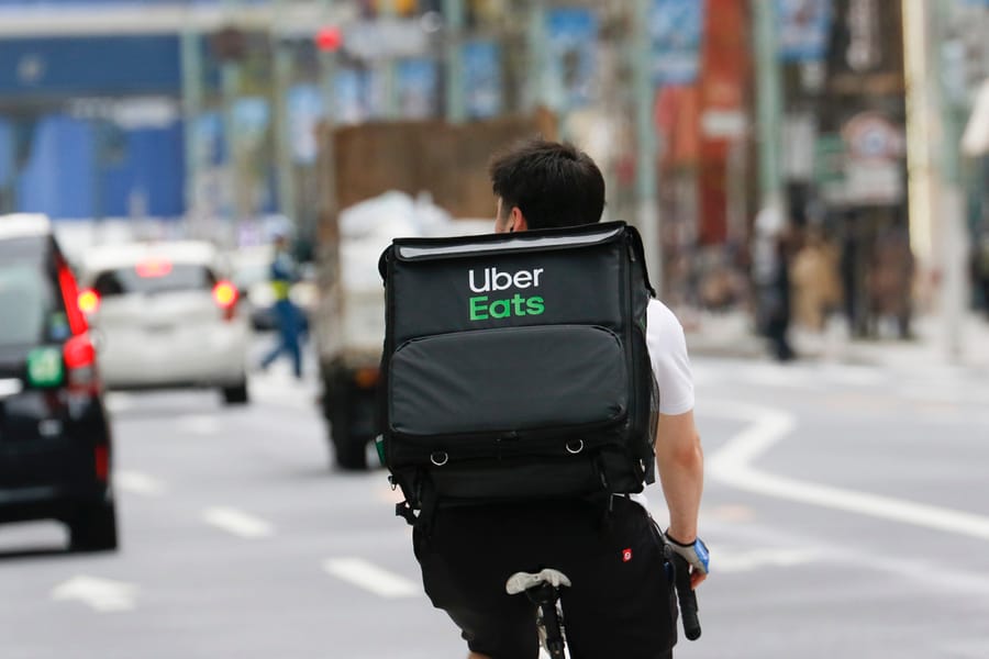 An Uber Eats Driver Is Seen At The Ginza Shopping District.
