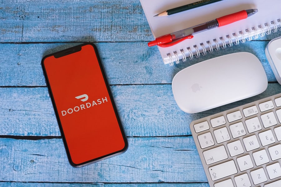 Doordash Iphone Display With Keyboard Mouse And Red Pen