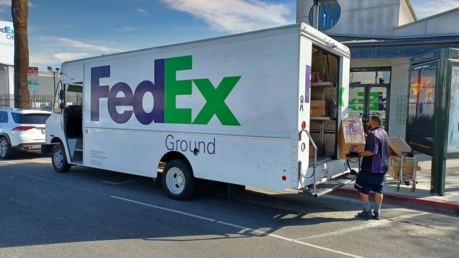 Fedex Employee Loading Delivery Truck