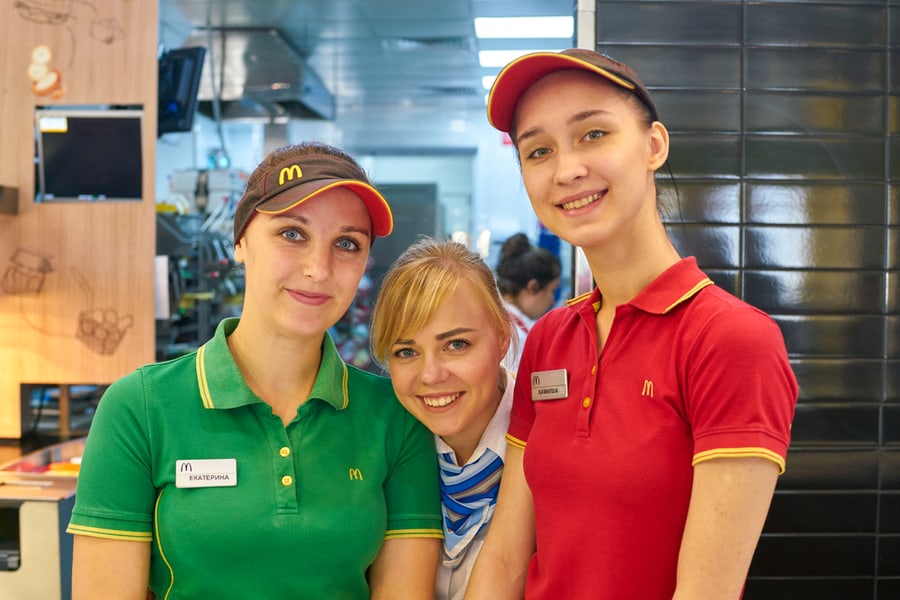 Indoor Portrait Of Workers In Mcdonald's Restaurant. Mcdonald's Is An American Fast Food Company.