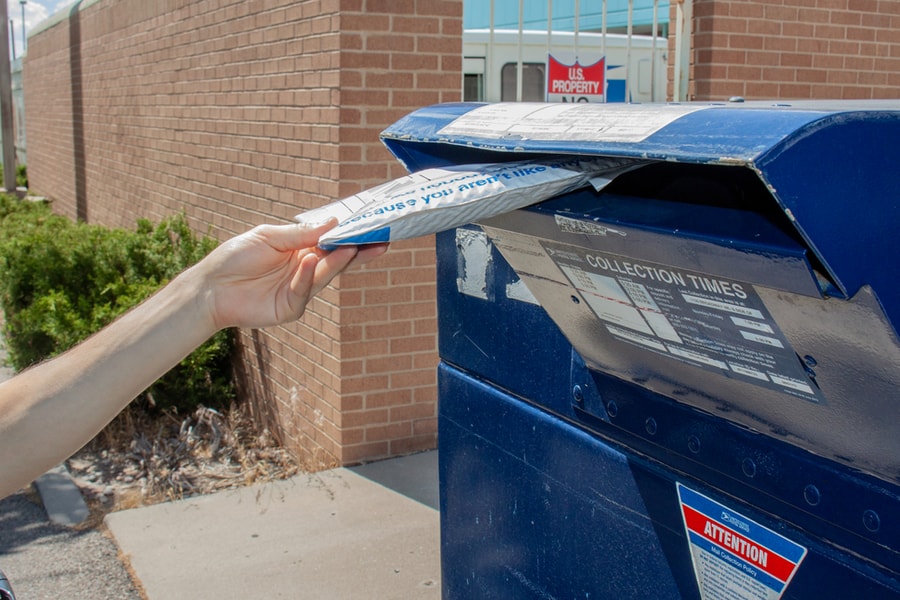 Man Drops Off Mail Package With Ebay Envelope At A Usps Mail Drop Box Outside The Post Office