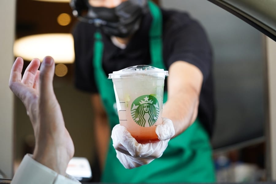Starbucks Workers Giving Order At Drive-Thru