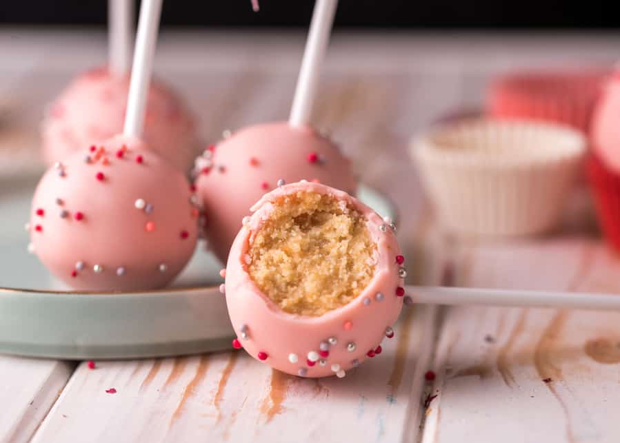 The Pastry Chef Decorates Cake Pops With Satin Ribbons