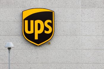 (United Parcel Service) Logo On A Facade. United Parcel Service Is The World'S Largest Package Delivery Company And A Provider Of Supply Chain Management Solutions