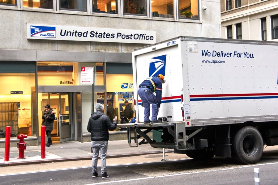 Usps Postman On A Mail Delivery Truck In New York