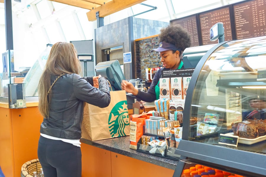 Woman Pick Up Order At Starbucks