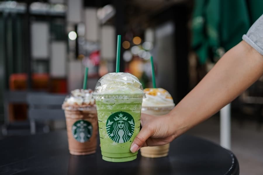Women Hand Holding Starbuck Green Tea Cream Frappuccino