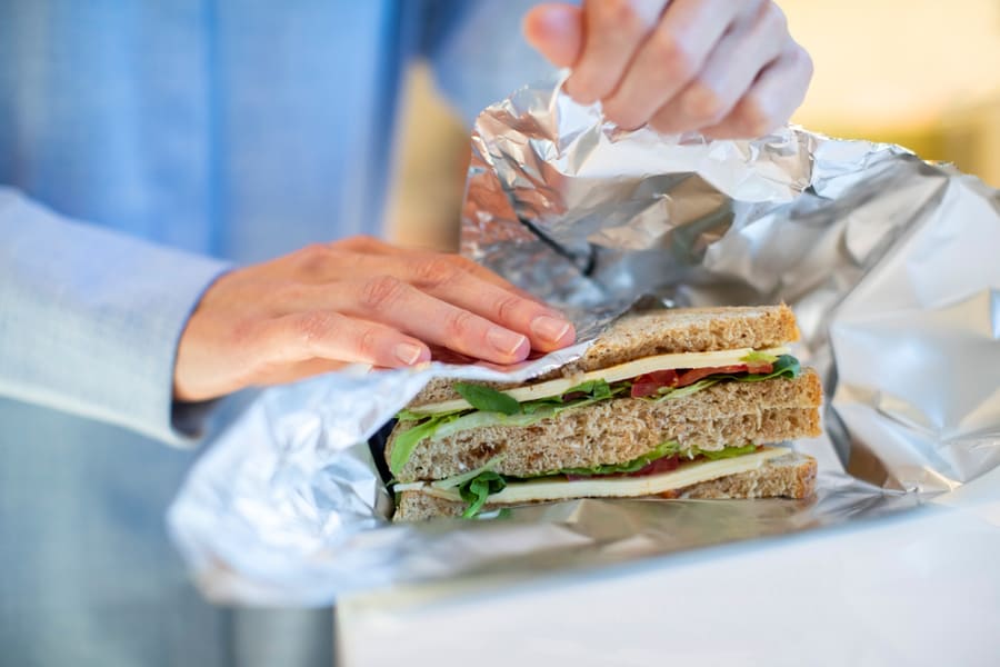 Wrapping Your Sandwich In A Paper Towel And Aluminum Foil