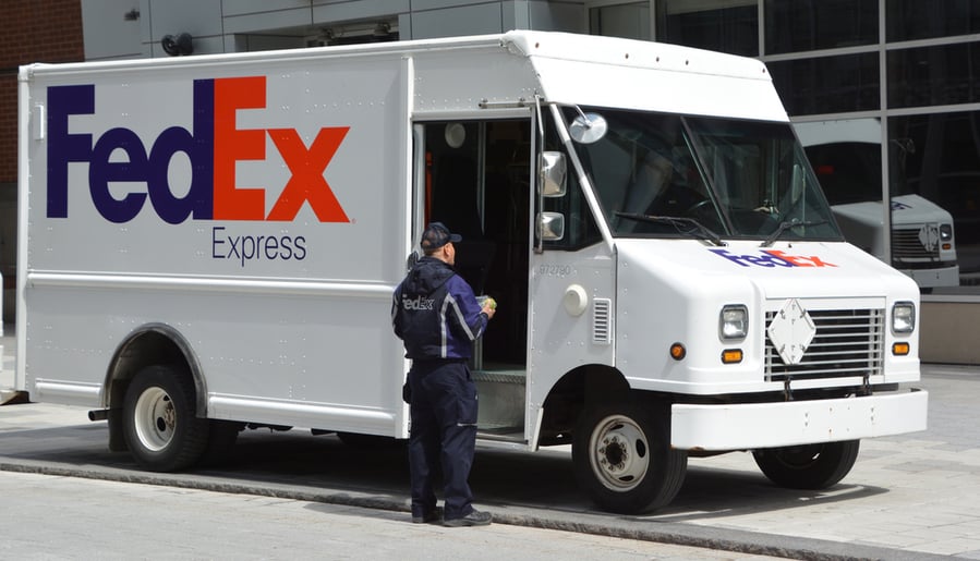 Fedex Logo On One Of Their Delivery Trucks In A Street