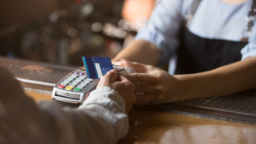 Female Customer Holding Credit Card Near Nfc
