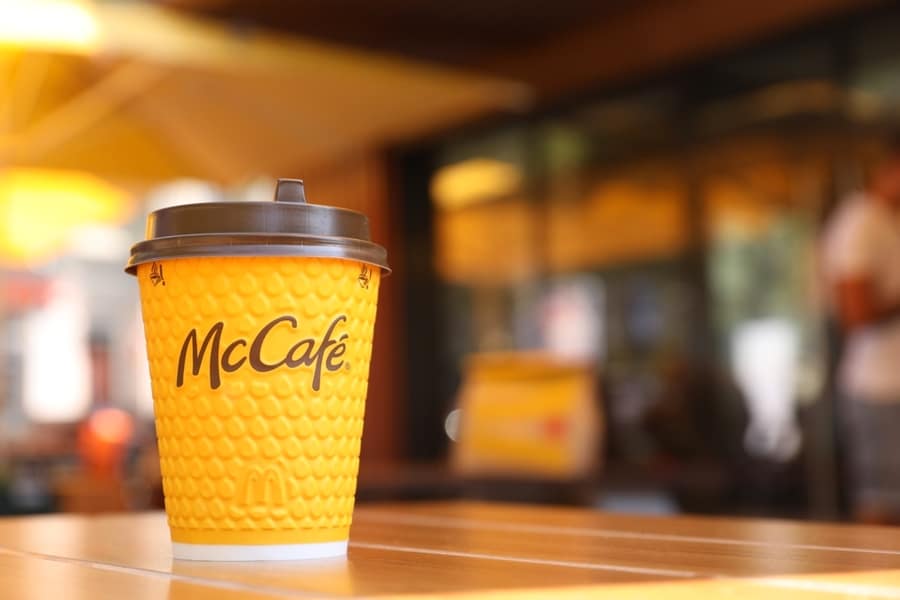 Hot Mcdonald's Drink On Table In Cafe.