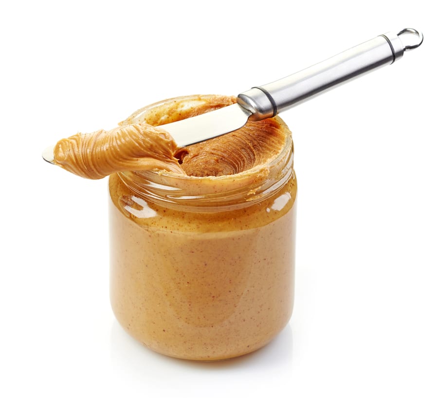 Jar Of Peanut Butter On A White Background