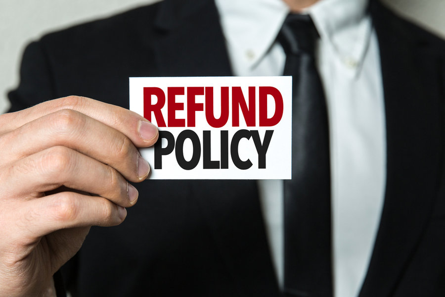 Man Holding Refund Policy Sign