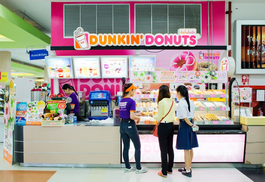 People Buying Donuts From Dunkin' Donut Shop