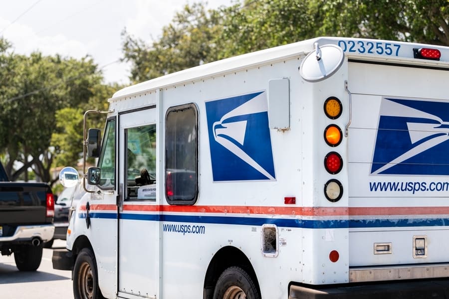 Small Usps Van Truck Delivering Packages