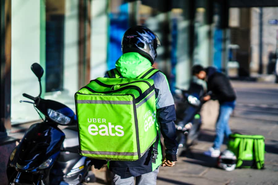 Uber Eats Delivery Person Carrying Food To People Who Order By Online App