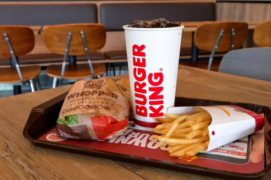 Urger King Set Has Hamburger French Fries And Cola Drink In Paper Glass On The Table In Burger King Restaurant.
